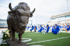For CAS' in-person commencement ceremony on May 16, graduates sat in chairs on the field at UB Stadium, while a limited number of guests were able to watch from the stands. Photo: Meredith Forrest Kulwicki
