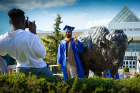 The bronze bull in front of the Center for the Arts is a popular place for new graduates to get their picture taken. Photo: Douglas Levere