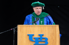 Cain offers remarks, his last to graduates as dean. He is stepping down as dean and vice president for health sciences in August to return to his position on the Jacobs School faculty. Photo: Sandra Kicman