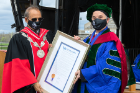 Thomas Russo (right), professor of medicine and chief of infectious diseases at the Jacobs School, receives the Chancellor Charles P. Norton Medal, UB's highest honor, from President Satish K. Tripathi. Photo: Sandra Kicman