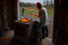 Ingo Sonder, research scientist in the UB Center for Geohazards Studies, stirs melting rock in an induction furnace. Extreme events are the special focus of the 2021 STRATUS conference, with attendees examining approaches for UAV mission planning, information gathering and decision-making for extreme conditions, rapid response or emergency management.