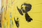 Jodi Lynn Maracle, a Mohawk artist and storyteller, shared a part of the Haudenosaunee creation story about a chickadee that sacrificed its life so humans could live that became part of the mural's imagery.