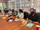 Medical students and Chris Sullivan (far right), UB Campus Ministry leader for the Christian Medical and Dental Association, work on the Halloween costumes.