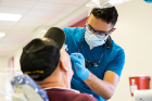 Throughout the day, more than 200 Buffalo-area dentists and hygienists, and UB dental students, faculty and staff volunteered their time to provide care that ranged from simple cleanings to oral surgery.