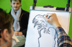 There have been various "stress-buster" activities available to students. Caricature artists were around on Monday.