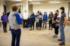 UB students volunteering at Journey's End Refugee Services get their marching orders. 