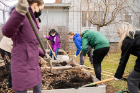 Volunteers work to move garden beds to a more accessible location at West Side Community Services, located at Vermont Street and West Avenue in Buffalo.