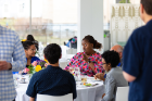 Letitia Thomas (center), assistant dean for diversity, School of Engineering and Applied Sciences, engages in a lively conversation with several scholars. Photo: Douglas Levere