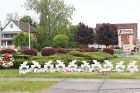Cutouts of peace doves feature the names of those killed in the shooting. From left: Margus Morrison, Roberta Drury, Katherine Massey, Celestine Chaney, Ruth Whitfield, Aaron Salter, Pearl Young, Heyward Patterson, Andre Mackniel and Geraldine Talley.