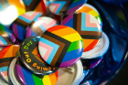 LGBTQ+ themed buttons, along with buttons with pronouns, were available for graduates and guests.