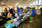 Families look over items for sale at the UB ReUSE tent. Photo: Douglas Levere