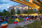 Some students, draped in flags of different nationalities, joined their peers for a chance to mingle and enjoy the evening. Photo: Meredith Forrest Kulwicki