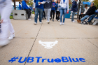 Fans making their way to UB Stadium encounter the True Blue message. Photo: Meredith Forrest Kulwicki