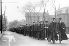 Samuel P. Capen (left) and University of Buffalo Council Chair Walter P. Cooke (right) lead the academic procession to Capen’s inauguration. The procession is marching up Edward Street.