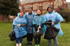 Heading back to campus after cleaning up trash on Winspear Avenue are (from left) Storiya Iqbal, a senior biomedical engineering major; Zara Braimah, a sophomore majoring in chemistry; Chloe Seyfert, a sophomore majoring in IT; and Ahmed Chowdhury, a freshman computer science major. 