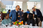 After the tour, the scholars enjoy dinner and conversation with President Satish K. Tripathi and Provost A. Scott Weber. Photo: Douglas Levere