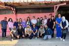 Othman Shibly (rear row, center, with white shirt and baseball cap) poses with some of the volunteers who provided dental care to children in schools and refugee camps in Lebanon.