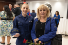 MFA student Hannah Walter (left) an ensign in the Coast Guard, poses with her mom.