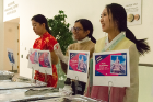 From pork dumplings to pad kee mao to plantains, the origins of the foods the students cooked and served were clearly explained. Serving food are (from left) Michelle Qiu, Sarah Choudhury and Erin Hong.
