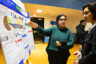Patatri Chakraborty (left) discusses research on plastics recycling with Diana Aga.