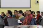 Fulbright scholars listen to presentations by a plenary panel on evidence-based solutions