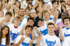 New students are horns up showing their True Blue spirit. 