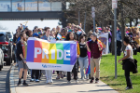 A group of students celebrating the first Pride Parade and Festival, marched down the academic spine on North Campus and enjoyed a small festival in the Student Union lobby.