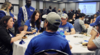 Current band members and alumni mingled and shared stories during the Century Celebration of the UB Marching Band.