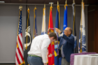 President Tripathi presents a cord to a graduating student at the annual commencement celebration.
