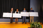 The Three Minute Thesis Competition (3MT), hosted by the Graduate School and the Startup and Innovation Collaboratory (CoLab) powered by Blackstone LaunchPad, took place in March 2024. Presentations took place in the Screen Room at CFA. The winners pose with their checks on stage. Photographer: Douglas Levere