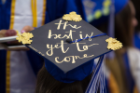 Decorated graduation cap at UB's commencement ceremony.