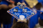 Decorated graduation cap at UB's commencement ceremony.