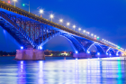 The Peace Bridge lights up the night with blue lights. 