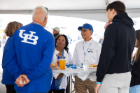 Celebrating Homecoming and Family Weekend in October, President Tripathi and Student Life leaders interacted with hundreds of parents and families at Saturday's football tailgate party.