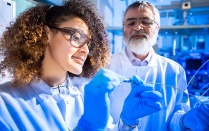 People working in a lab. 