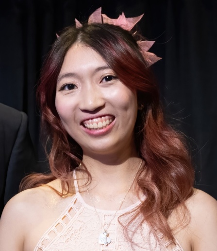 Asian student with red-brown hair. 