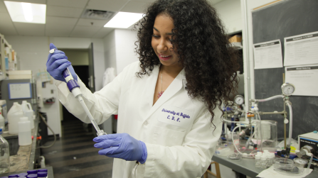Jada Mowatt wearing a lab coat. 