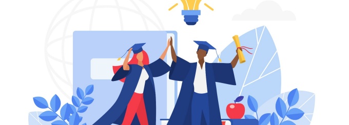 Two students in commencement regalia. 