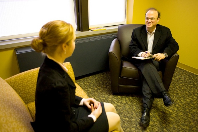 Jeffrey Lackner speaking with a patient. 