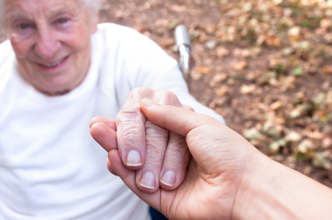 Elderly person getting a helping hand. 