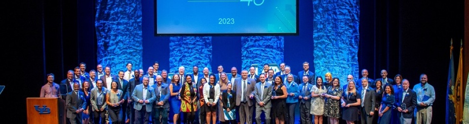 Dozens of participants stand onstage together at the Fast 46 contest. 