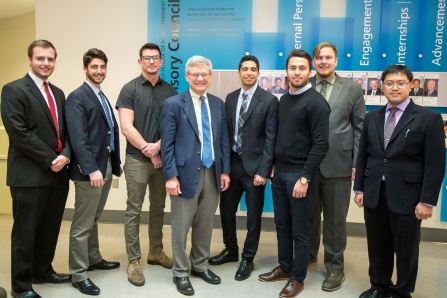 Winners of the Student Entrepreneur Fellowship Competition (eLab) stand with Provost Charles F. Zukoski in the Alfiero Center at the School of Management. 