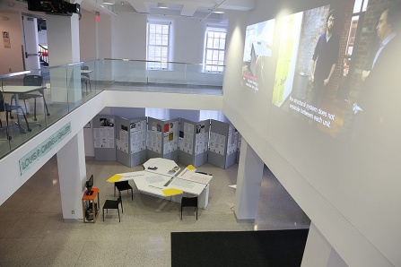 The "Now What?!" exhibit in Hayes Hall as viewed from the second floor looking down on the displays. 