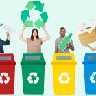 4 people standing behind 4 recycling bins. 