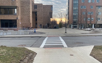 Crosswalk and path to the barrier-free entrance in the Fargo Quadrangle. 