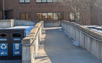 Ramp to the barrier-free entrance on the west side of Alumni Arena. 