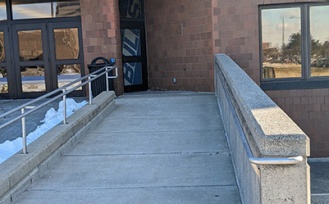 Ramp to the barrier-free entrance on the west side of Alumni Arena. 