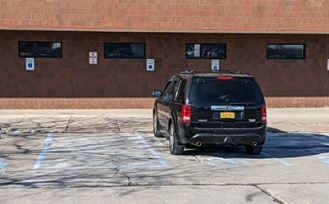 Accessible parking on the east side of Alumni Arena. 