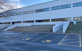 Accessible parking on the west side of the Incubator and Co-Working at Baird Park building. 