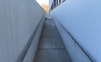 Ramp to the barrier-free entrance on the west side of the Incubator and Co-Working at Baird Park building. 